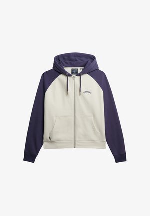 Hættejakke med lynlås, cremefarvet krop og lilla raglanærmer. Har en hætte, frontlommer og "Superdry"-logo over lynlåsen. Blødt materiale.