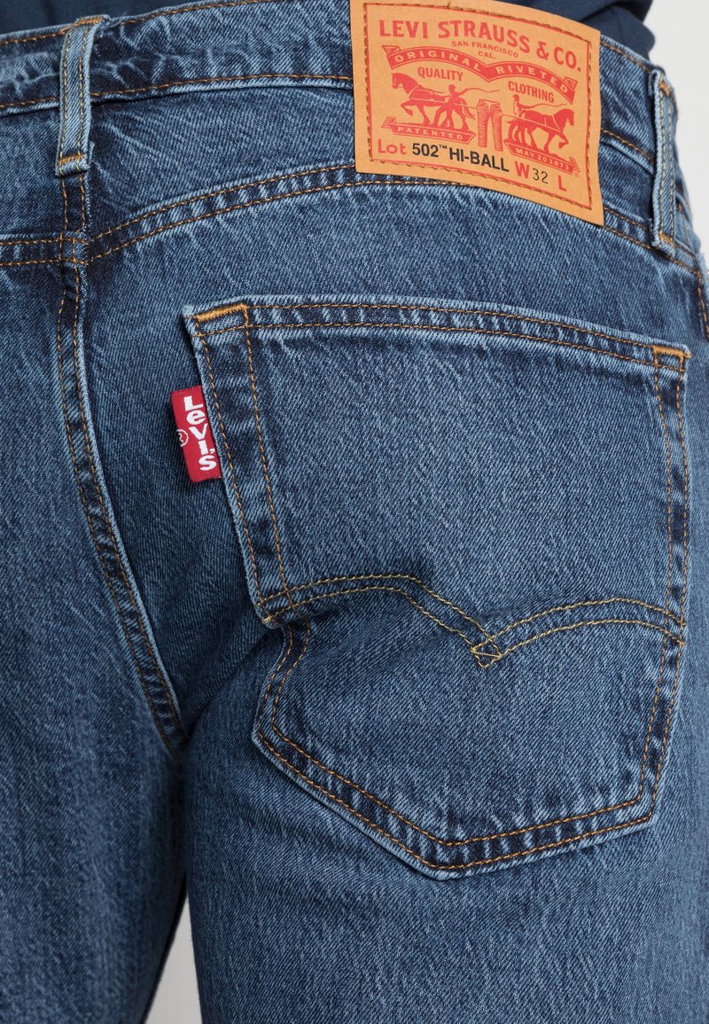 Levi's® 502™ TAPER HI-BALL - Straight leg jeans - blue comet base/blue  denim 