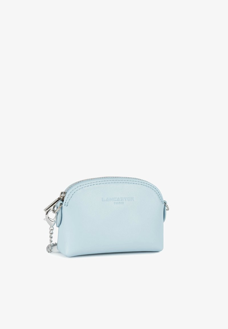 Small light blue leather pouch with curved top zipper and silver chain clasp, embossed with "LANCASTER PARIS" on front.