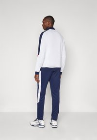 Fila TRACKSUIT MANUEL SET - Tracksuit - white/navy