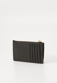Black leather wallet with a textured surface, featuring a zip closure and four card slots on one side. Compact and rectangular shape.