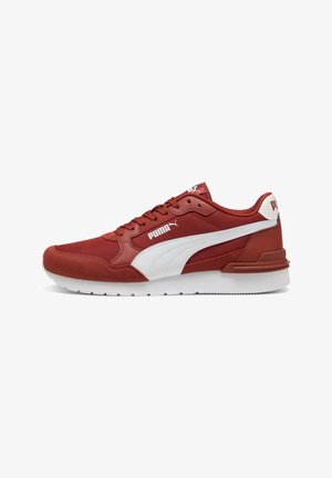 Red Puma sneaker with white side stripe, white sole, lace-up design, and Puma logo on side and heel tab.