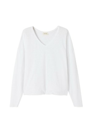 Top bianco a maniche lunghe con scollatura a V realizzato in tessuto leggero. Presenta una vestibilità rilassata con spalle leggermente cadute e un orlo dritto.