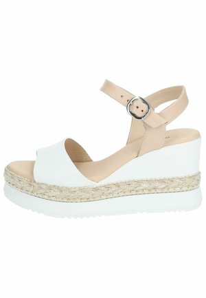 Sandalo con zeppa in pelle bianca e cinturino alla caviglia beige. Dettagli in juta sulla suola con piccoli accenti dorati. Design con punta aperta.