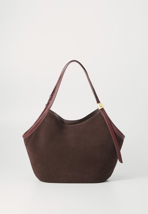 Dark brown suede tote bag with an adjustable leather strap featuring a gold-tone buckle, set against a plain white background.