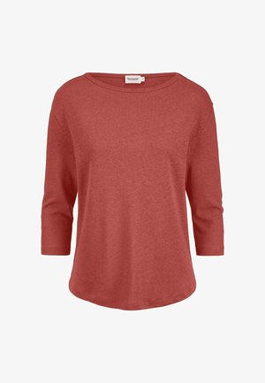 Damenshirt mit langen Ärmeln in Rostfarbe, mit rundem Ausschnitt und leicht gewelltem Saum, aus weichem Stoff gefertigt.
