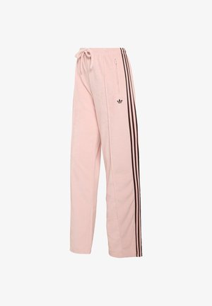 Svetloružové tepláky s opasokom na šnúrku, čiernymi bočnými pruhmi a malým čiernym logom. Obsahujú bočné vrecko na zips.