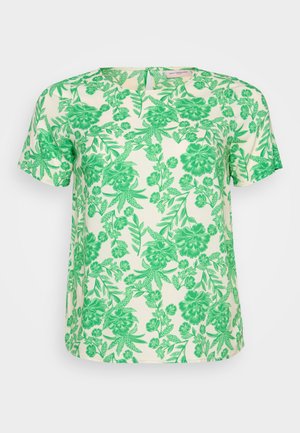 Kratki rukavi gornji dio od svijetlog kremastog materijala s vibrantnim zelenim cvjetnim i lisnatim uzorkom, s okruglim izrezom i opuštenim krojem.