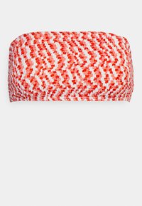 Top bandeau padrão vermelho e branco, com tecido texturizado, apresentando um design trançado e um acabamento suave, com bordas arredondadas.