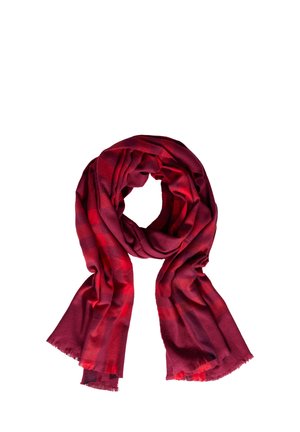Red plaid scarf made of soft fabric, featuring a lightweight texture and frayed edges, arranged in a loose loop.