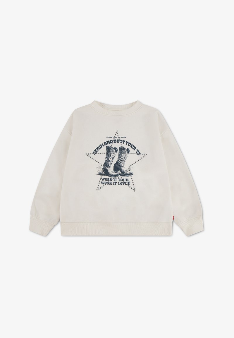 Sweat beige avec graphique noir de bottes de cow-boy dans une étoile et texte indiquant "Levi's Live in Tour" et "Wear it loud, wear it Levi's."