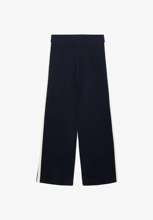 Námořnické modré kalhoty s širokými nohavicemi a vysokým pasem, s bílými postranními pruhy, rozložené na bílém pozadí.