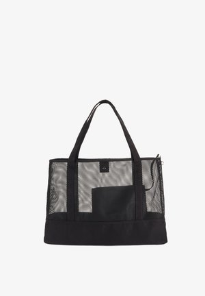 Black mesh tote bag with sturdy fabric base, two long handles, and a zip closure. Features a solid black pocket accent on one side.