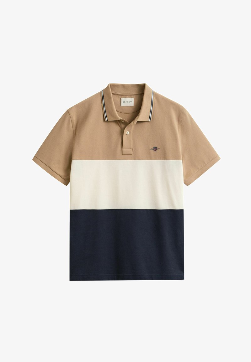 Kurzärmeliges Poloshirt mit beiger Oberseite, weißem Mittelteil, marineblauem unteren Bereich, Knopfleiste mit zwei Knöpfen und kleinem, auf der Brust gesticktem Logo.