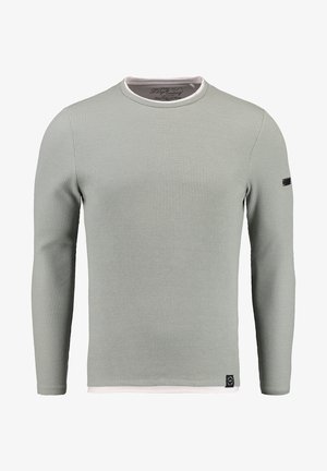 Langarmshirt aus hellgrünem Rippstoff, mit einem weißen Rundhalskragen und einem kleinen schwarzen Logo auf dem linken Ärmel.