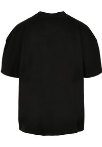 Schwarzes, übergroßes T-Shirt, kurze Ärmel, runder Ausschnitt, lockere Passform, glattes Baumwollgewebe, keine sichtbaren Logos oder Muster auf der Rückseite.