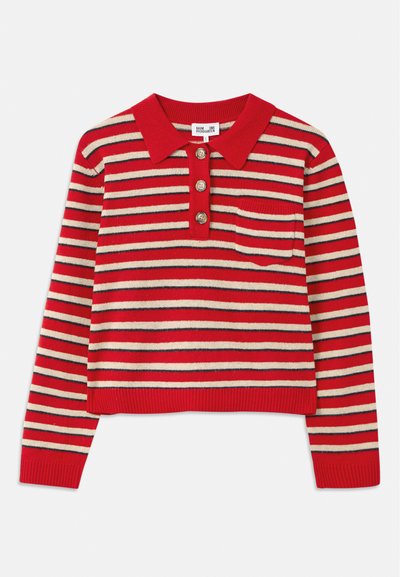 Sarkana un krēmkrāsas svītraina džemperis ar apkakli, trīs pogu apģērba aizdari un krūšu kabatu. Adīta tekstūra un ribota piedurkņu un apakšmalas apdare.