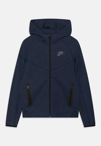 Navy blue zip-up hoodie with a hood, featuring a smooth texture, black zipper, and two side pockets with zip closures. Nike logo on chest.