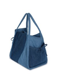 Μπλε τσάντα tote από τζιν με διχρωμίες, δύο μακριές λαβές, εξωτερική τσέπη με ύφασμα δέσιμο στο πλάι και ανοιχτό πάνω μέρος.
