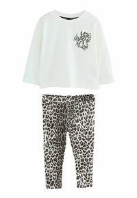 Hvid langærmet top med små leopardmønstre på brystet, parret med leggings med leopardprint til børn.