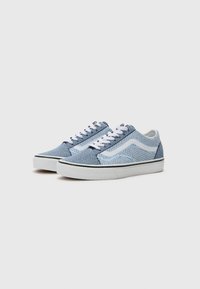 Blue and light blue mesh sneakers with white laces, contrasting black rubber sole, and signature logo on the side. Textured surface details.