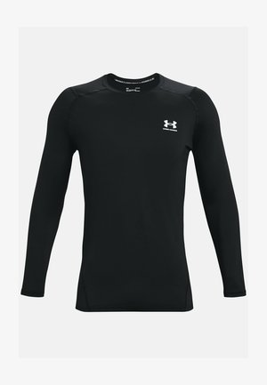 Black long-sleeve athletic shirt made of smooth, stretch fabric, featuring a crew neckline and small white Under Armour logo on the chest.