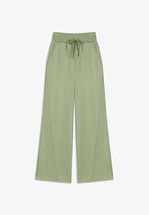 Lichtgroene wijde broek gemaakt van een zachte, rekbare stof. Voorzien van een elastische tailleband met een trekkoord en zijzakken.