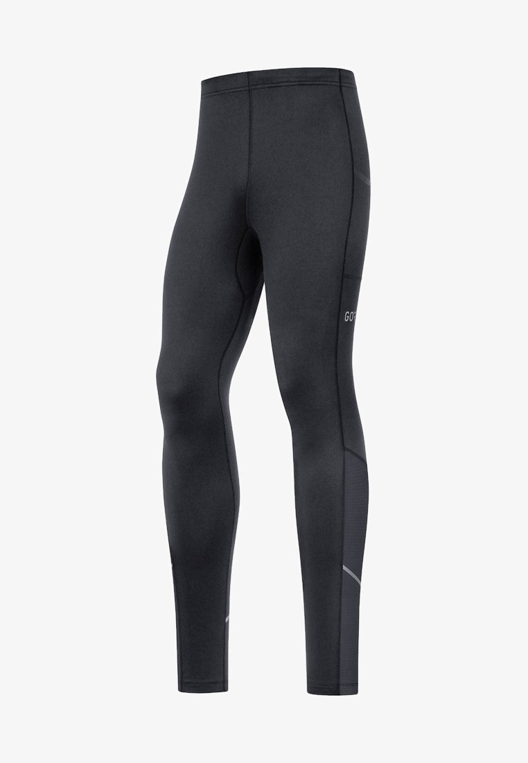 Leggings de sport noirs avec une texture lisse, une coupe ajustée, des accents réfléchissants, et un détail de poche sur le côté. Le matériau semble extensible et durable.