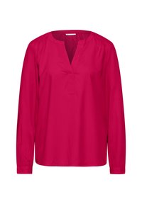 Blusa de manga larga en un vibrante color rosa, con escote en V, corte holgado y textura suave. Sin patrones ni acentos visibles.