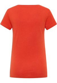 Red cotton t-shirt with short sleeves, a round neckline, and a smooth texture. Features a simple, unadorned design with clean edges.