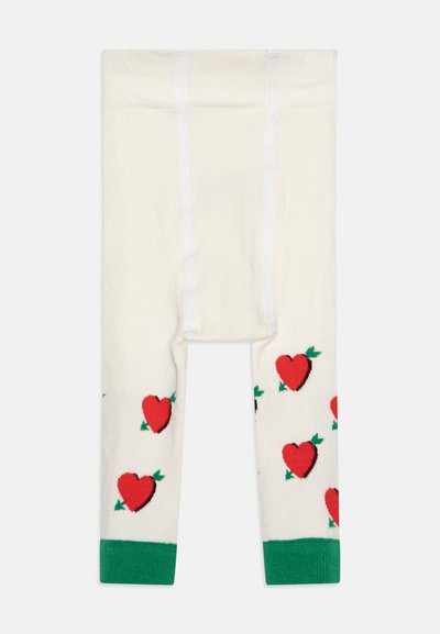 Leggings valmistettu pehmeästä kankaasta, kermaisen värisiä vihreillä hihansuilla, joissa on toistuva kuvio punaisista sydämistä vihreiden lehtien kanssa.