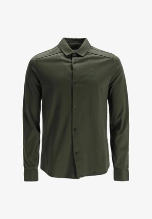 Tumes roheline pikkade varrukatega nööbiga särk, valmistatud siledast kangast. Omab teravat kraed ja väikest brodeeritud ruudukujulist logo.