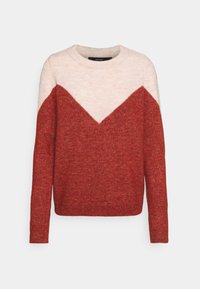 Röd och beige stickad tröja med ett chevronmönster. Rundad hals och långa ärmar, strukturväv, åtsittande nederkant. Mjuk material.