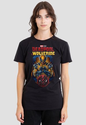 Black cotton t-shirt featuring a graphic of Deadpool and Wolverine, with vibrant colors, dynamic poses, and superhero-themed accents.