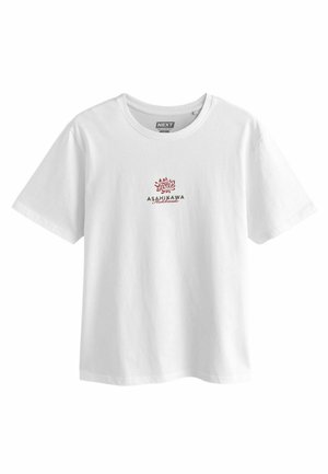 White cotton t-shirt featuring red and green text with "ASAHIKAWA" and "Hokkaido" below an intricate floral design on the front.