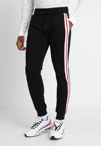 Urban Classics - TERRY TONE SIDE STRIP PANTS - Jogginghose - black/white/firered Thumbnail-Bild 1