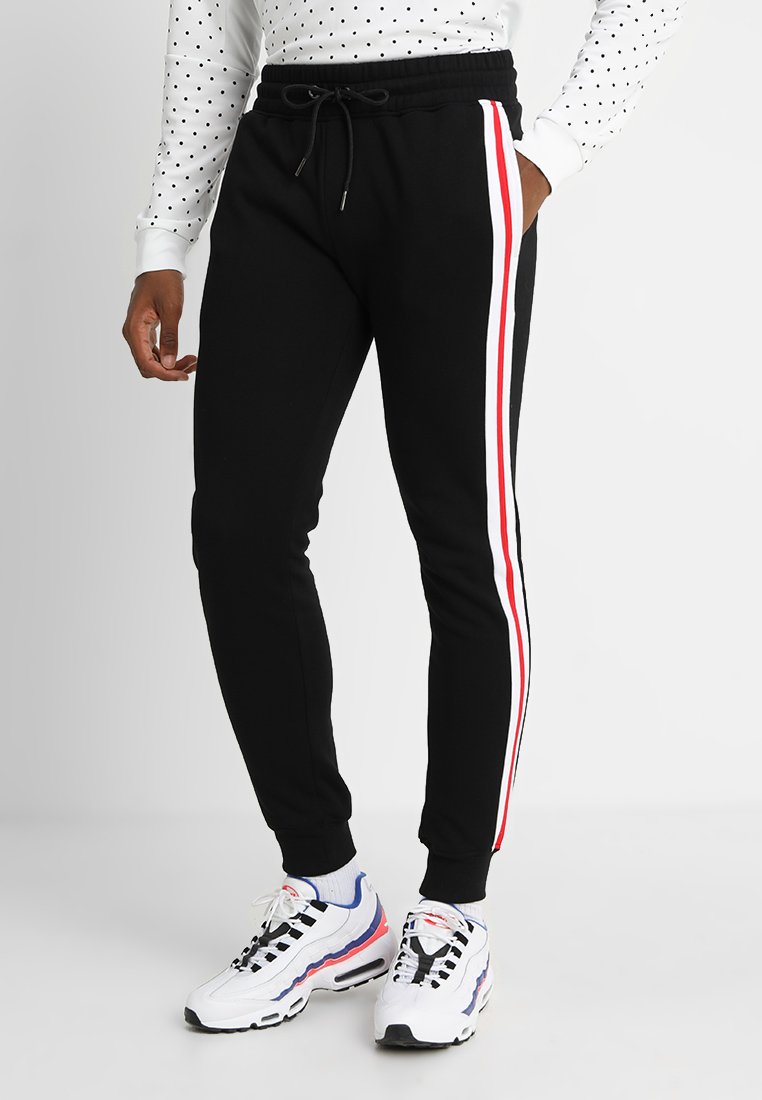 Urban Classics - TERRY TONE SIDE STRIP PANTS - Jogginghose - black/white/firered, Vergrößern