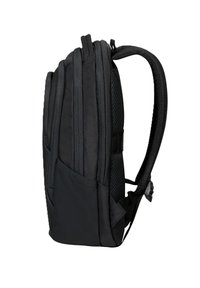 Zaino nero con un esterno imbottito e testurizzato, dotato di numerosi scomparti con zip e spallacci in rete per il comfort.