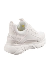 White athletic sneaker with a textured mesh upper and synthetic overlays. Features a padded collar, round toe, and a thick rubber outsole.