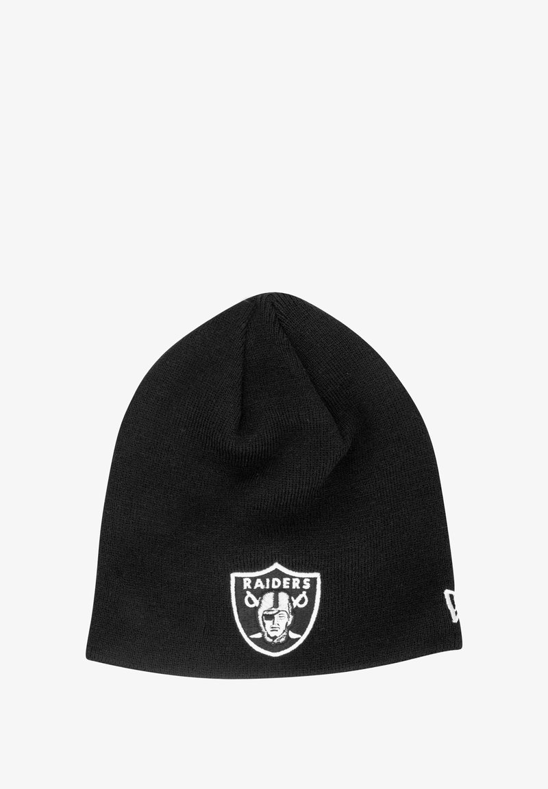 Black knit beanie featuring a white embroidered Raiders logo with a shield design. Soft texture, elongated shape, and no visible hardware.