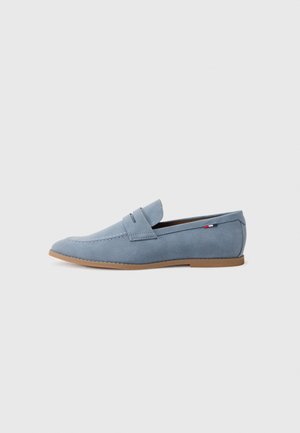 Light blue suede loafer with a smooth texture, decorative stitching, and a brown rubber sole. Features a penny slot design on the upper.