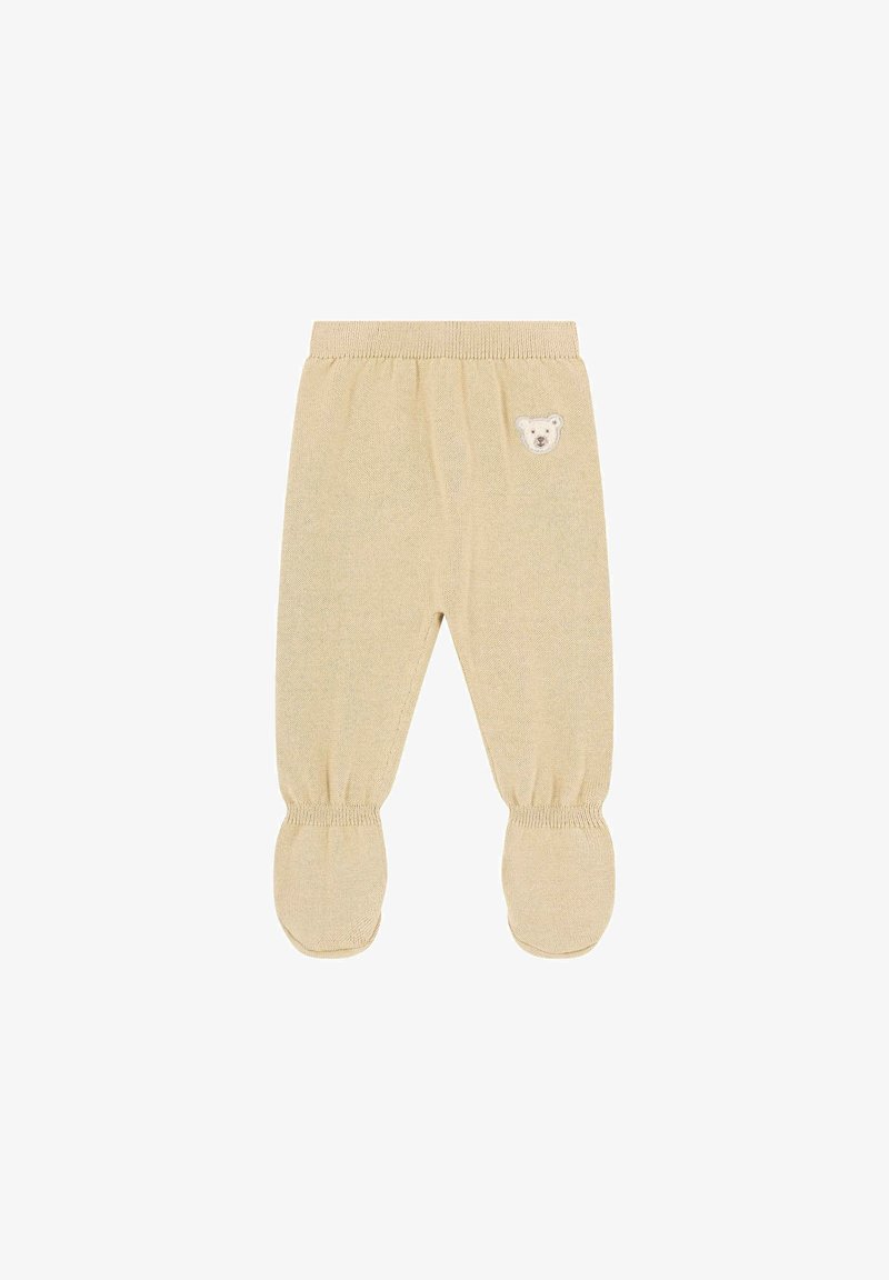 Beige katoenen babybroekjes met een berenhoofd appliqué, een elastische tailleband en voetjes. Geweven structuurpatroon over het geheel.