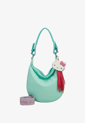 Sac à main en tissu turquoise doux, de forme courbée, avec un charme Hello Kitty et des franges roses, accompagné d'une anse lilas.