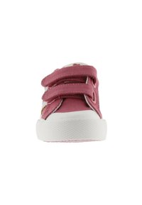 Scarpa di tela rosa con due cinturini regolabili in Velcro, suola in gomma bianca, grip testurizzato e stampa floreale sulla fodera interna.