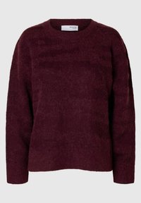 Bordo spalvos megztinis su minkštu, tekstūruotu paviršiumi, apvalia iškirpte ir ilgomis rankovėmis, laisvo modelio ir minimalistinių siūlių.