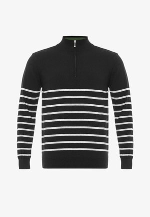 Pull-over en maille noire avec un col montant, présentant des rayures horizontales blanches. Comprend une fermeture éclair quart de tour avec des éléments métalliques argentés et des poignets côtelés.