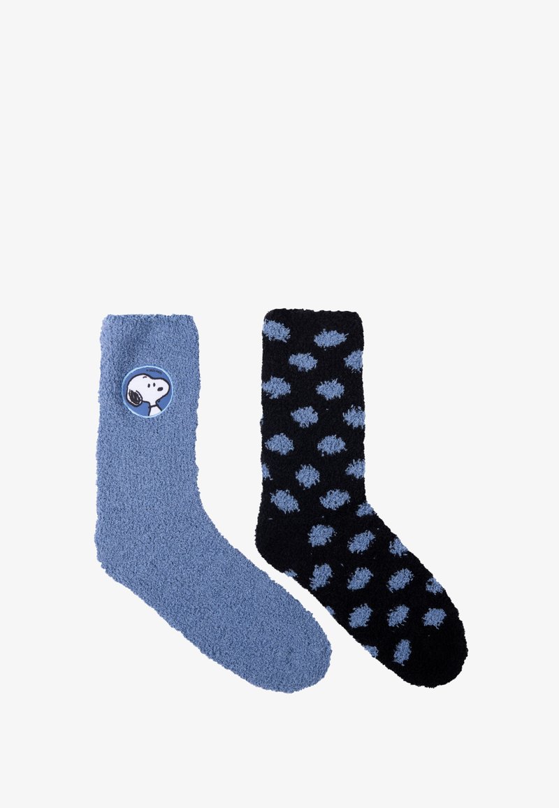 Blue fuzzy sock with a Snoopy design and a black fuzzy sock featuring blue polka dots. Soft material, mid-calf length, textured surface.