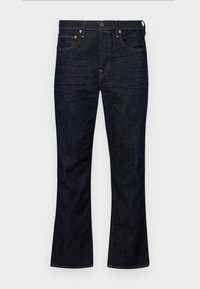 Vaqueros de mezclilla oscura de corte acampanado con cintura alta, cinco bolsillos y detalles de costura en naranja. La tela tiene una textura suave y resistente.