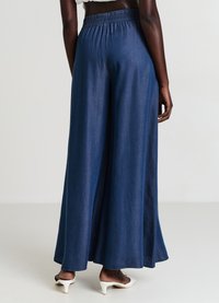 Calliope Jeans a zampa - blu denim scuro