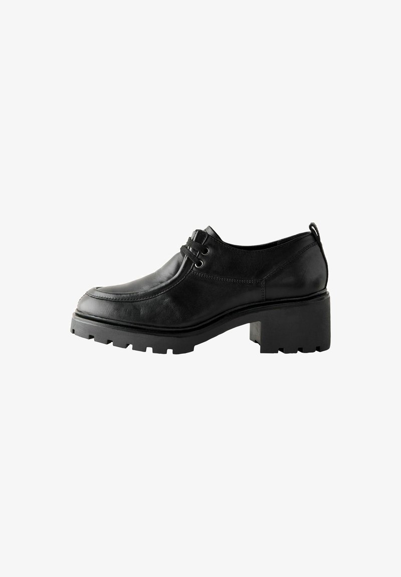 Black leather shoe with a rounded toe, textured upper, double lacing, and thick, chunky sole. Features a modest block heel.